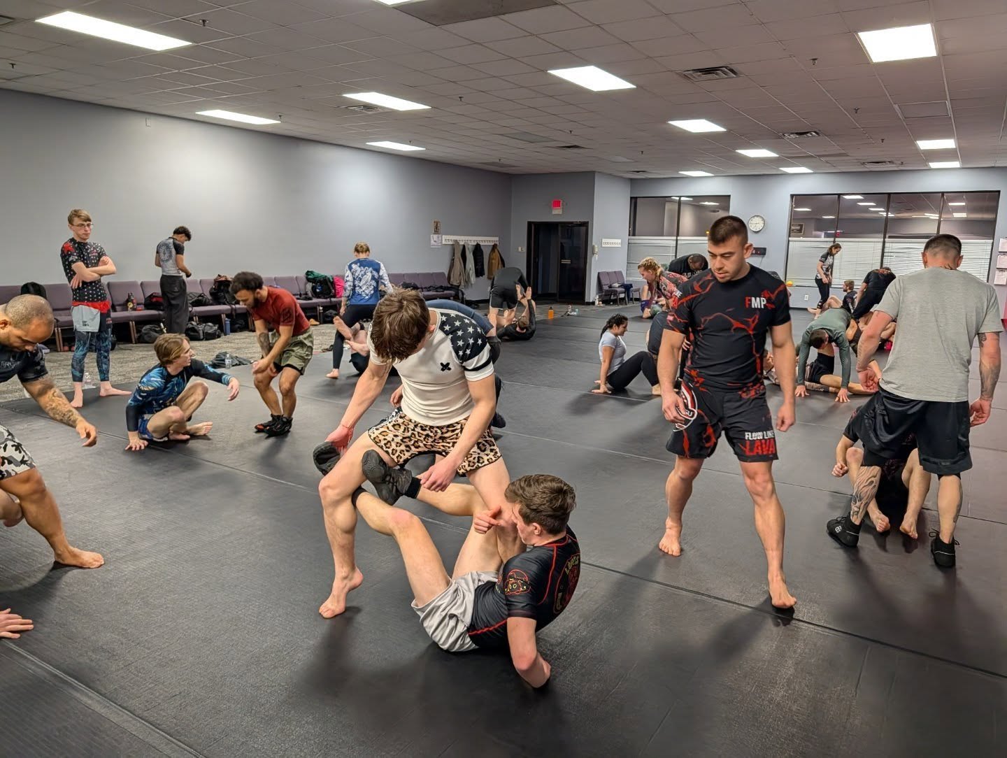 Students training on the mats at Loris Brazilian Jiu-Jitsu in Loves Park, IL